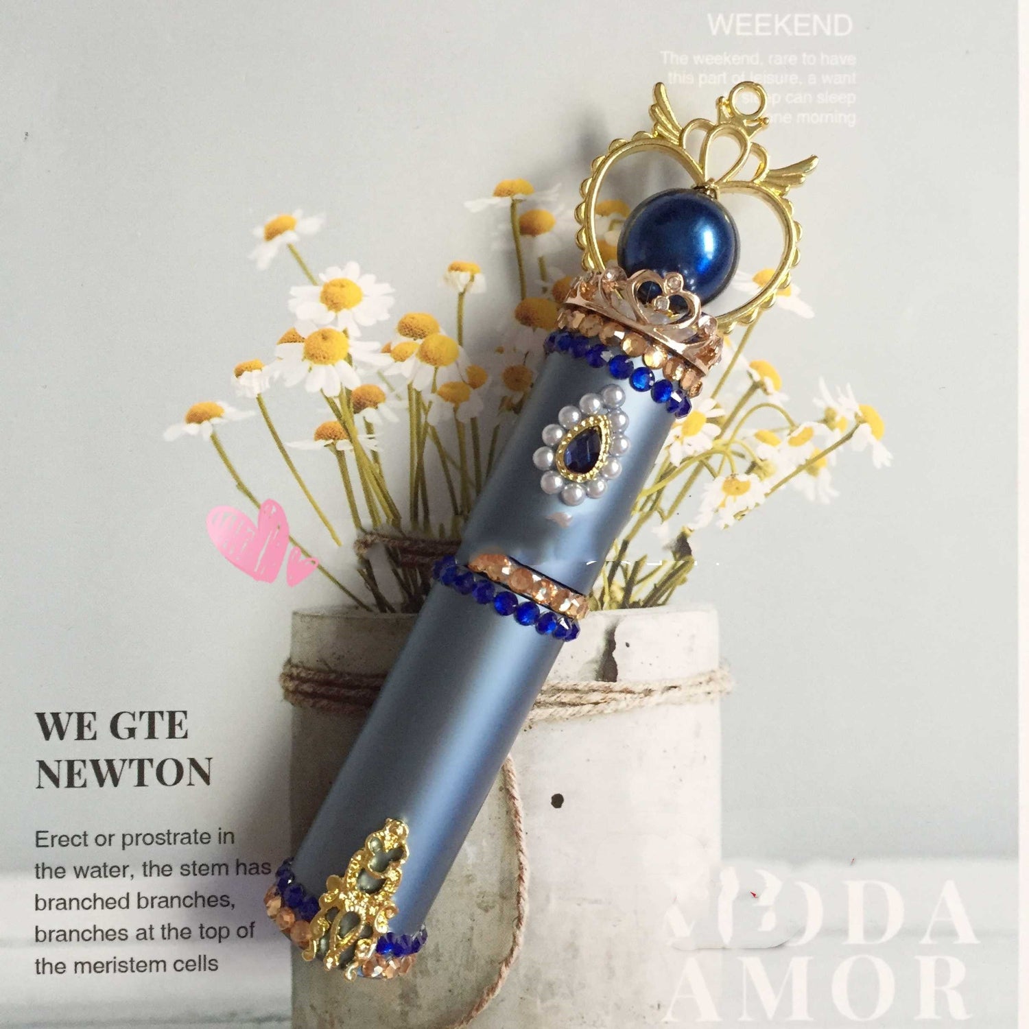 blue perfume bottle on magazine background