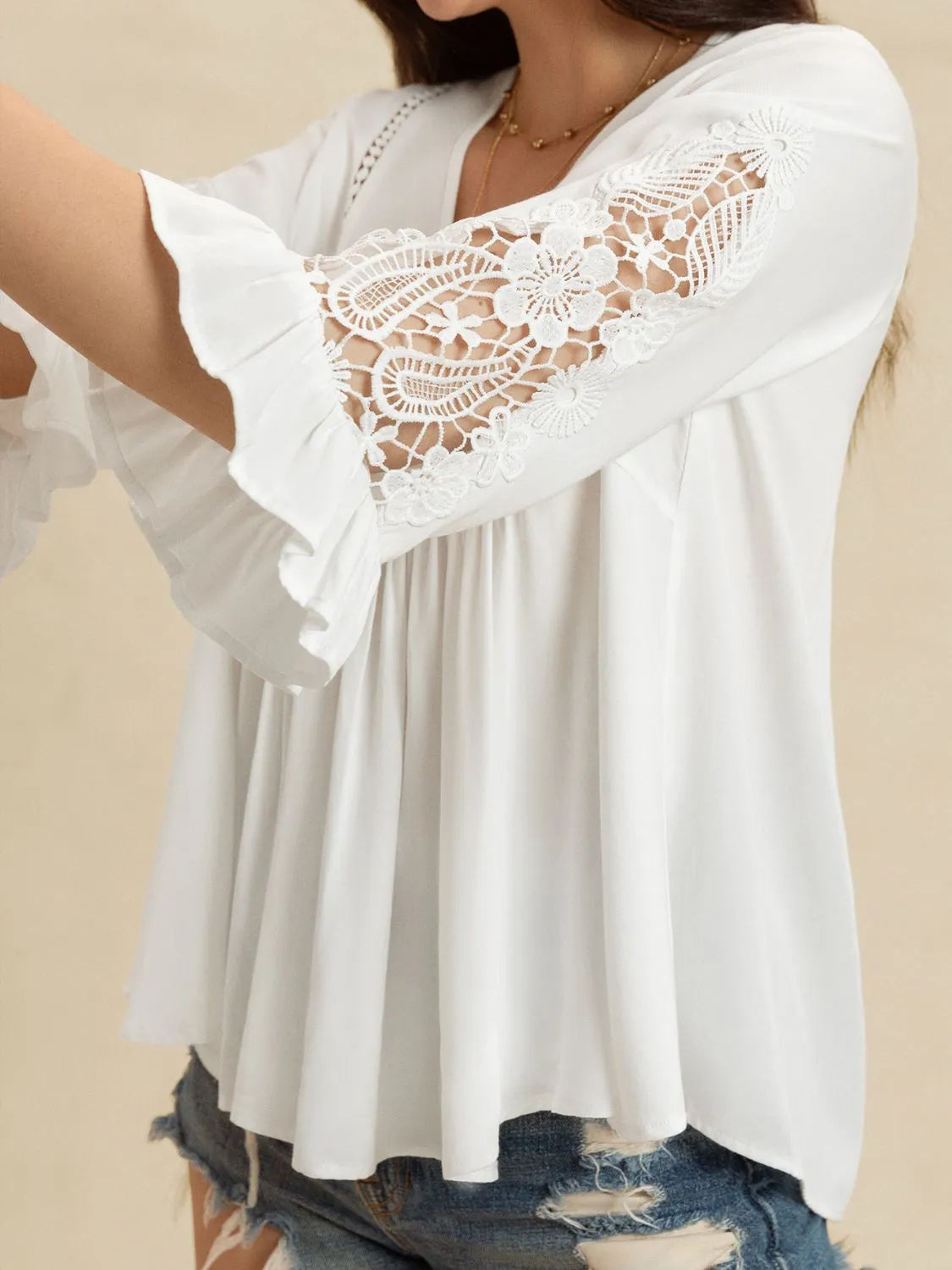 Close‑up side view of the Enchanted Lace Flounce Sleeve Top highlighting the lace trim and flounce sleeve detail.