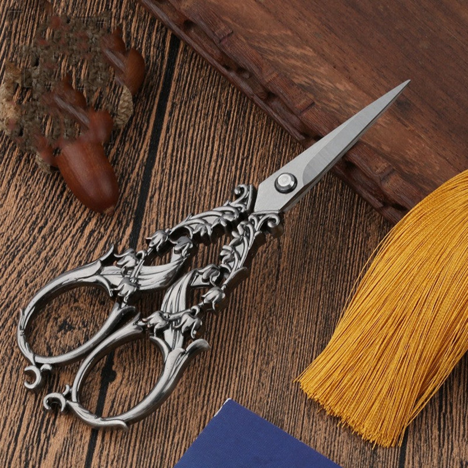 scissors on wooden background