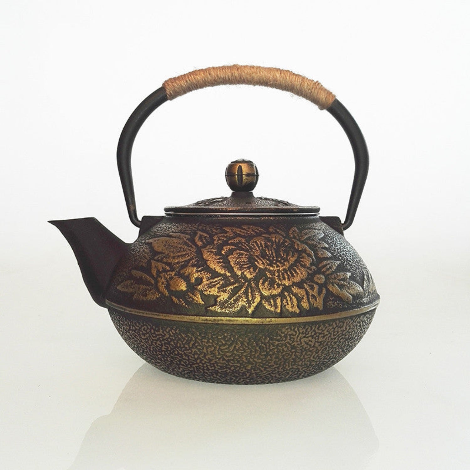 Cast Iron teapot on a white background