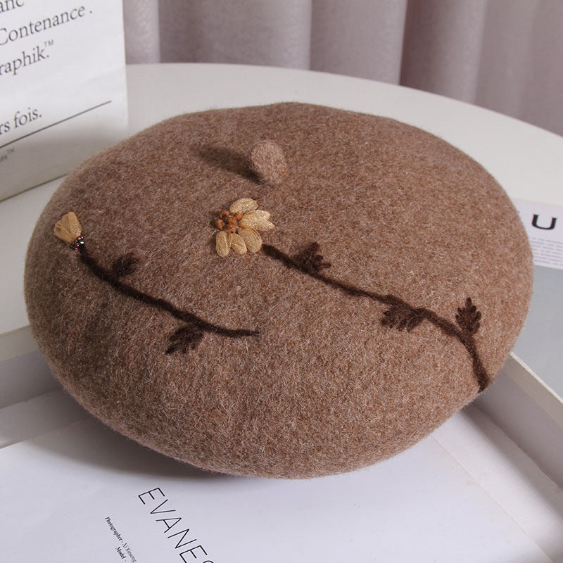 camel brown beret sitting on a white table