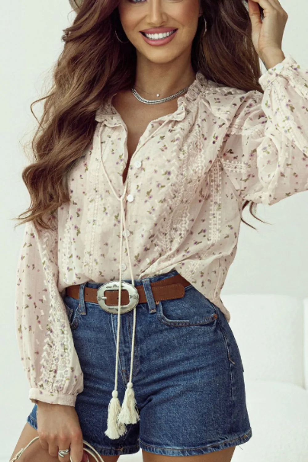  Another front angle of the floral printed tie‑neck blouse with lace and frill details.