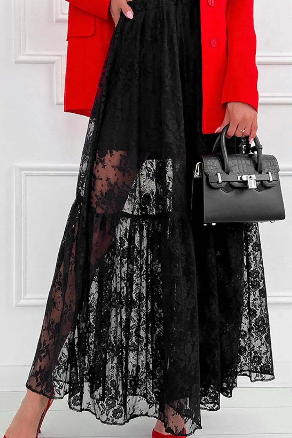 Close‑up of the black lace fabric showing the floral pattern and semi‑sheer texture.