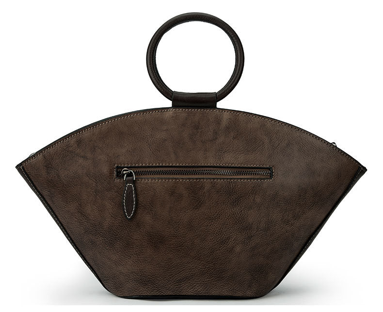 back view of Vintage‑style leather Boston bag with an embossed flower inside a bottle‑shaped motif