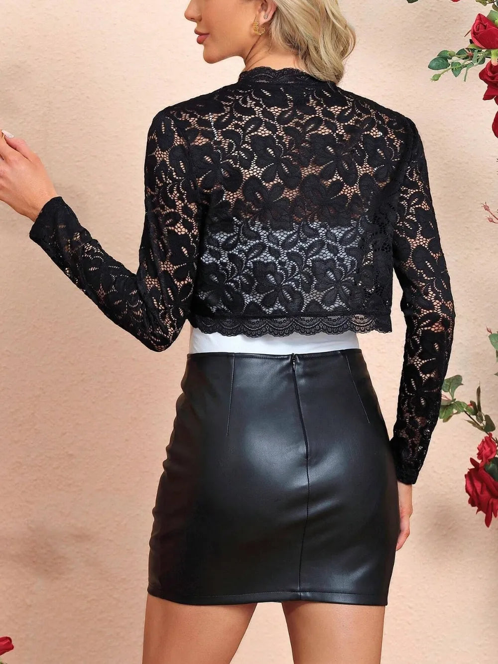 Back view of the black lace open‑front long sleeve cover up showing sheer lace detail.
