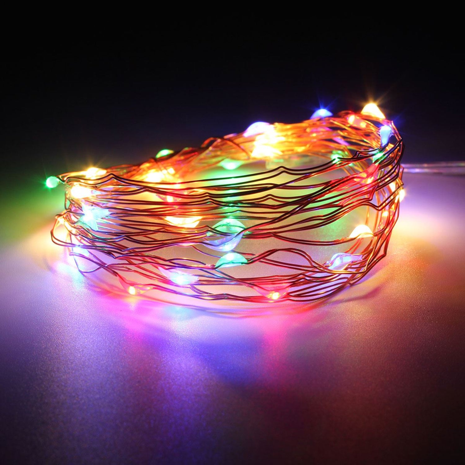 Multicolored string lights on a dark background