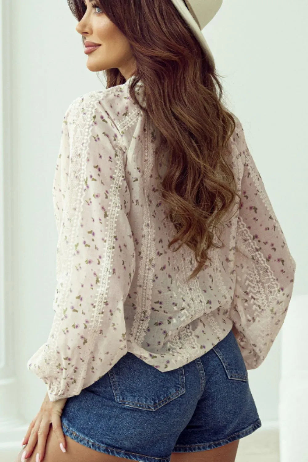 fBack view of the printed long sleeve blouse, showing the lightweight fabric and relaxed fit.