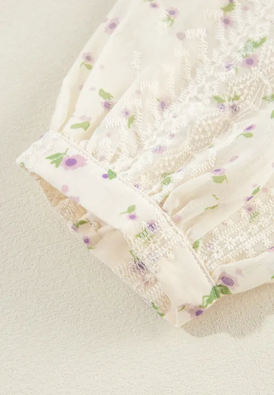 Close‑up of the long sleeve and cuff showing the lace frill detailing on the blouse.