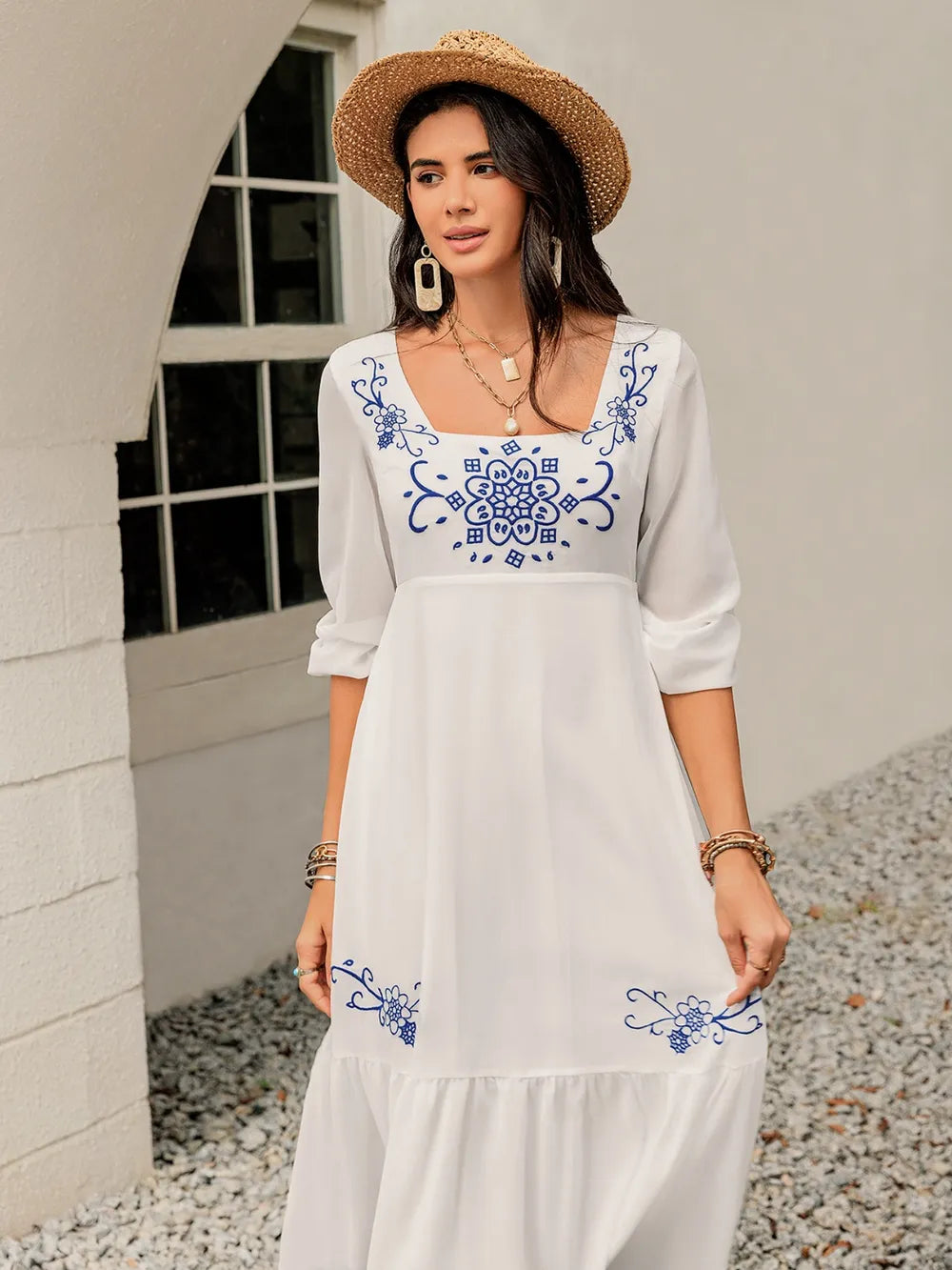 Front view of the square‑neck balloon sleeve dress on the model, highlighting the soft floral print and relaxed fit.