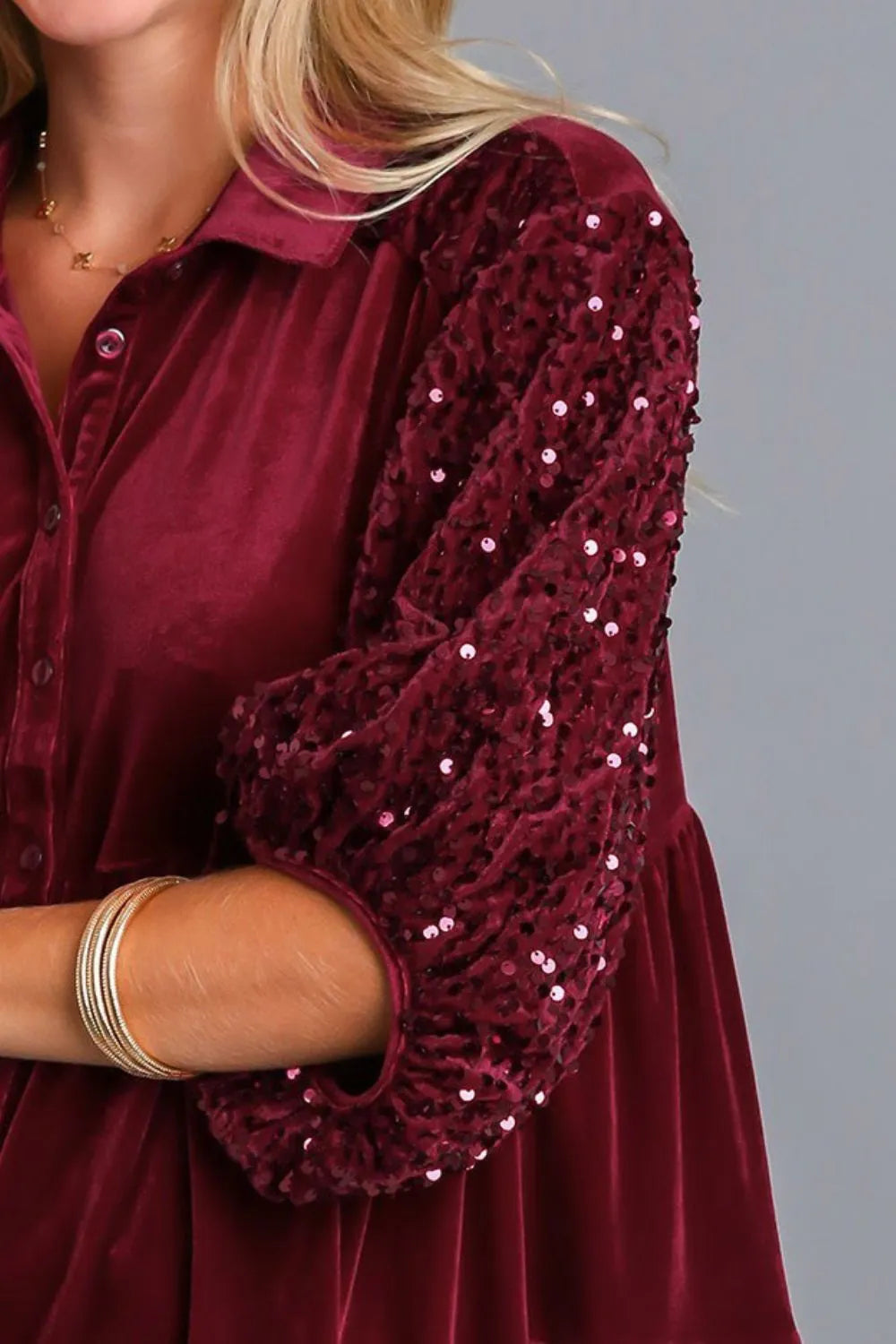  Close‑up of the half sleeve on the wine Umgee top, highlighting the sequin detailing