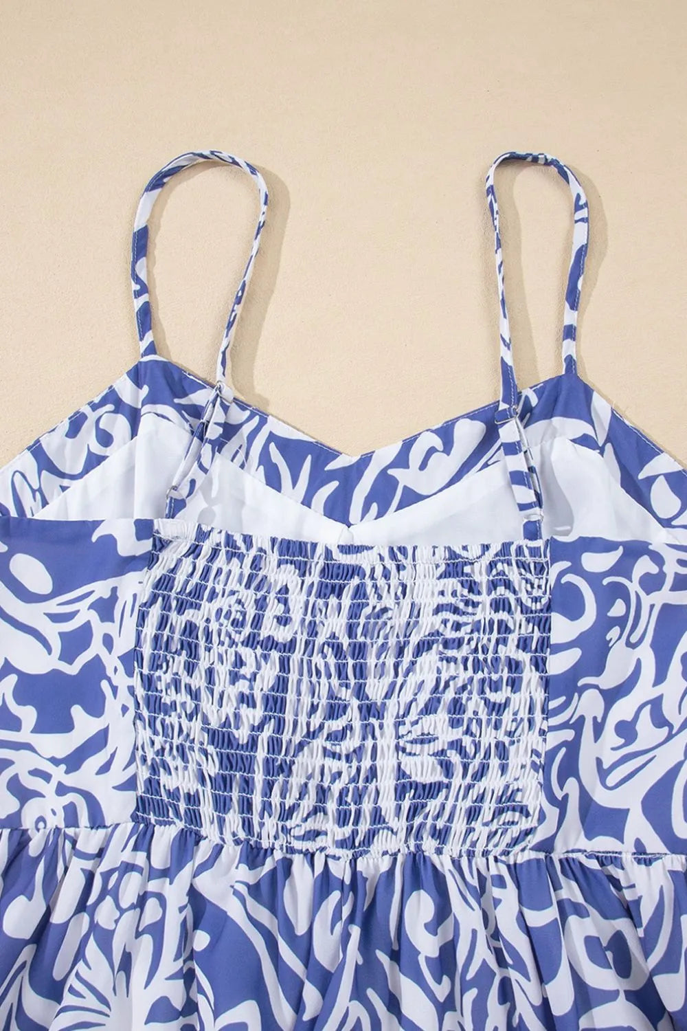 Close-up of the back of the spaghetti‑strap top, focusing on stitching and material detail