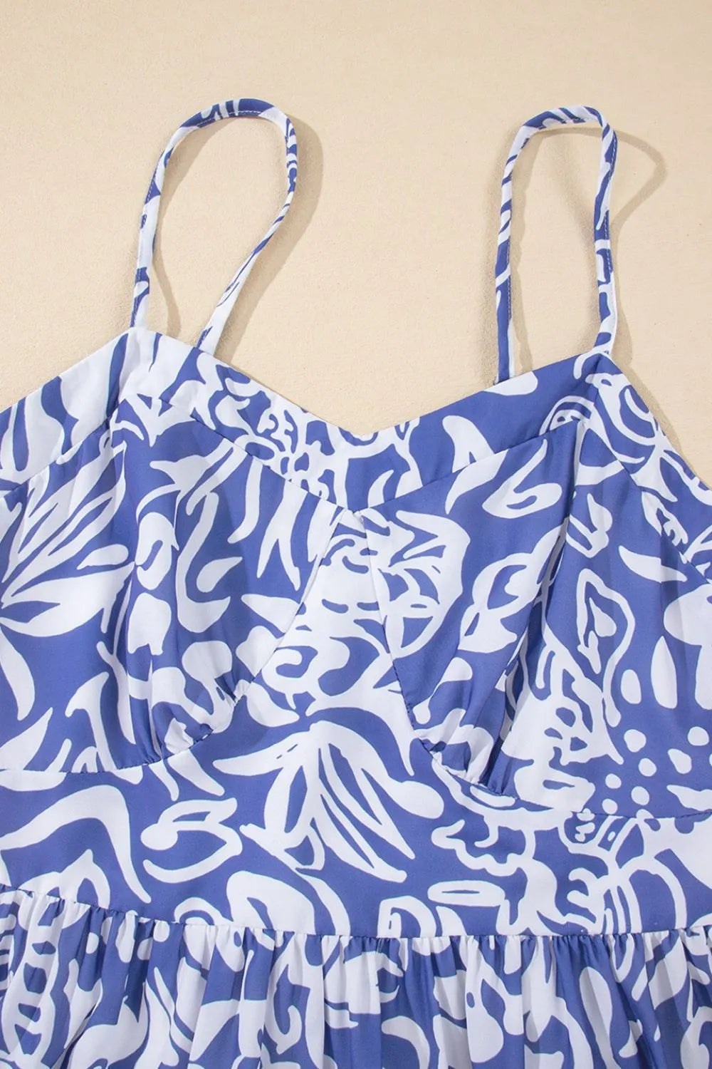 Close-up of the front of the spaghetti‑strap top, showing the neckline and fabric texture.