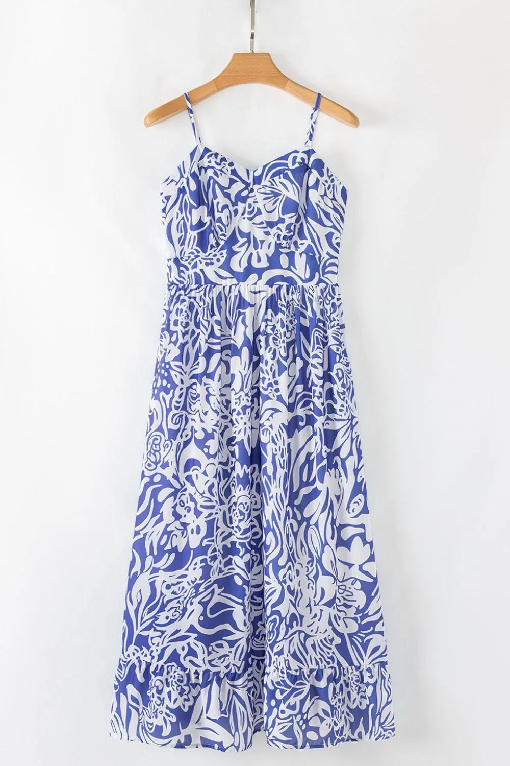 Front of the spaghetti‑strap sundress displayed on a hanger, showing the full shape and ruffle detail.