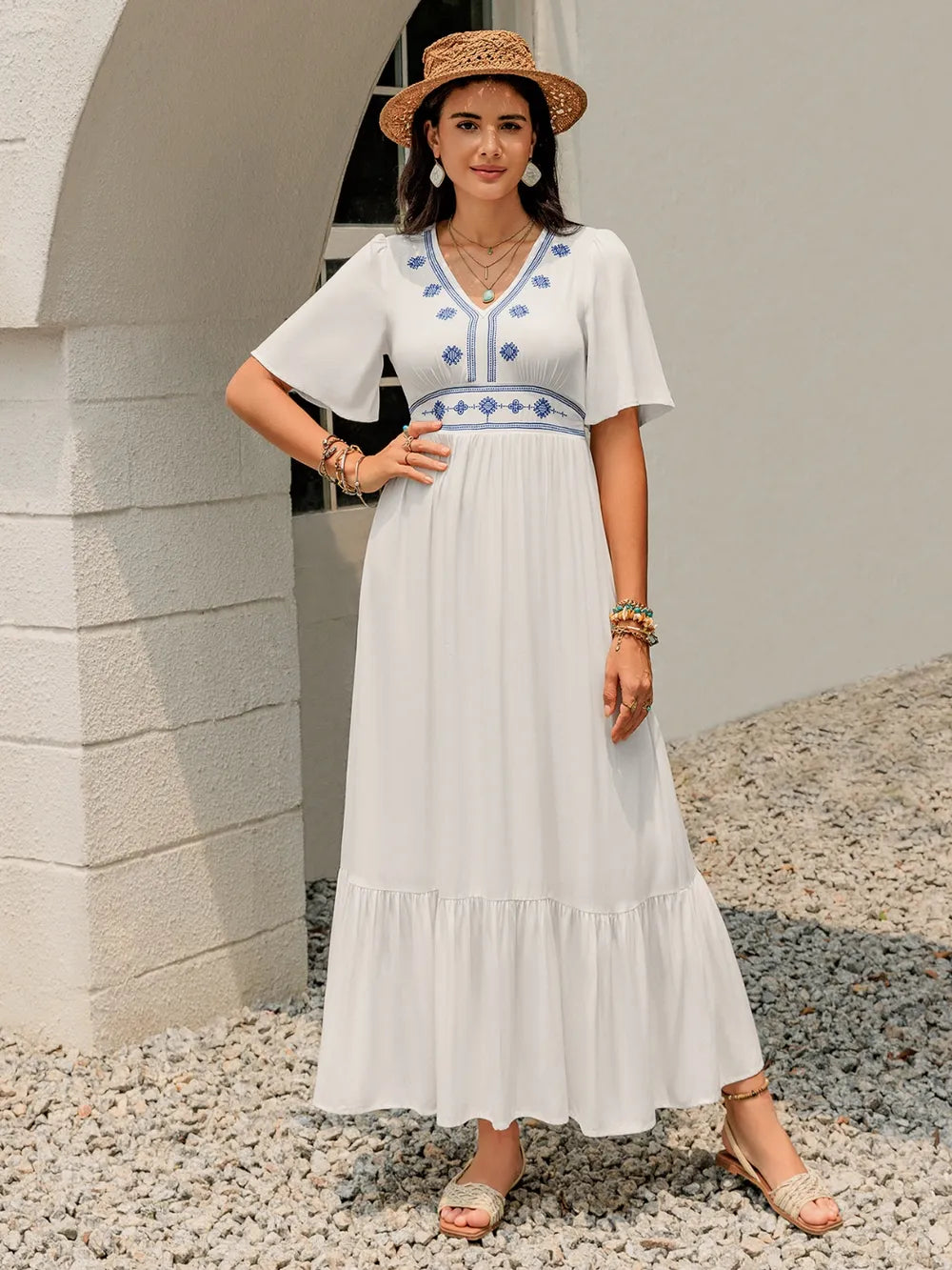 Front view of the White Briar Cottage Dress on the model, highlighting the V‑neckline and soft, flowy silhouette.