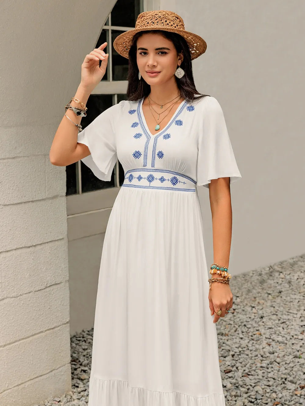 Another front angle of the White Briar Cottage Dress, showing the flutter sleeves and gentle movement of the skirt.