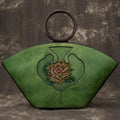 Woodland green Vintage‑style leather Boston bag with an embossed flower inside a bottle‑shaped motif.